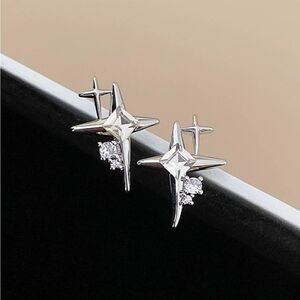 Free with bundles of $20 or more! SHEIN silver star earrings